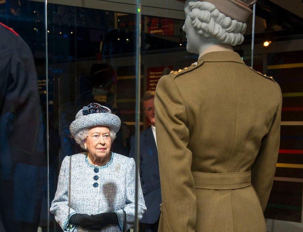 The Queen looking at her former uniform during museum visit in 2017