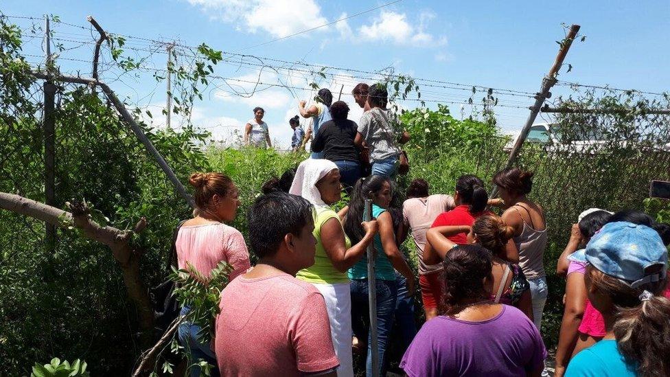 Family of inmates of the Acapulco prison, tear down a security fence of the prison after a internal riot where at least 28 were killed, at the prison in Acapulco