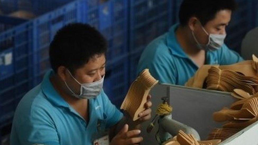 Workers on a production line at the Huajian shoe factory in Dongguan, in southern China's Guangdong province (14 September 2016)