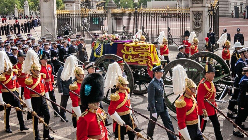 The Queen's coffin passes Buckingham palace