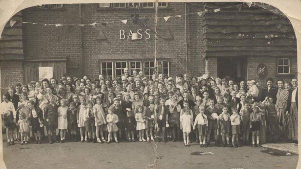 People outside a Bass pub in Hinckley