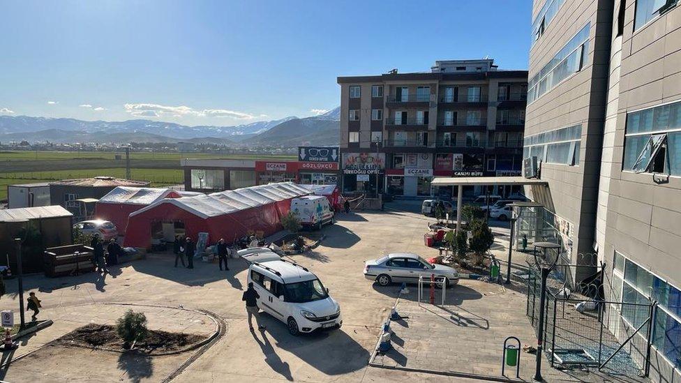 Members of the UK Emergency Medical Team construct a tented field clinic next to a hospital that was damaged in the Turkey earthquake.