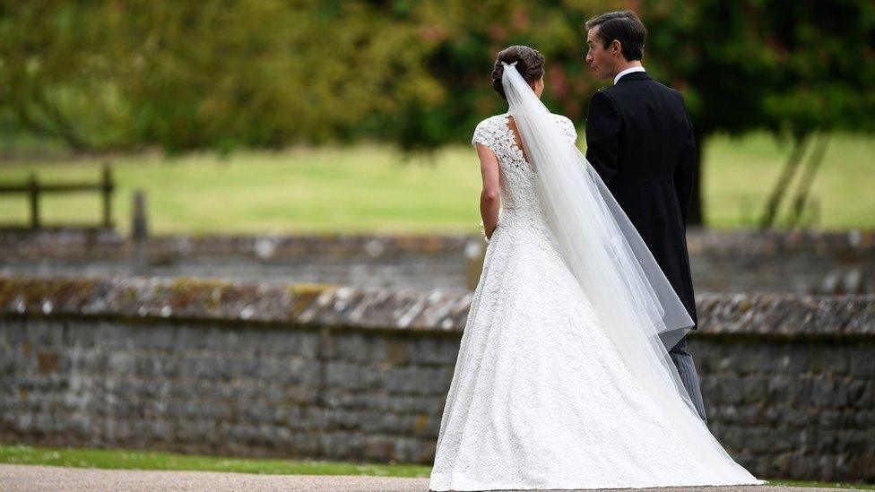 Pippa Middleton and her new husband James Matthews leave following their wedding ceremony.