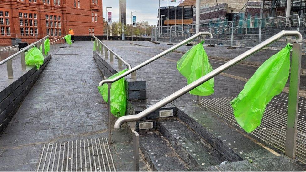 Empty bins in readiness for a new day outside the Senedd