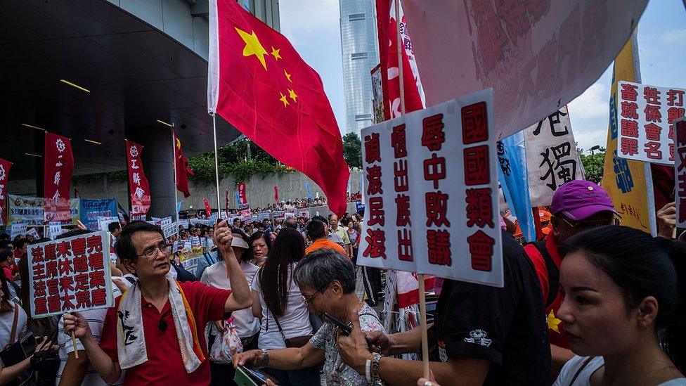 Pro-government supporters gather outside Legislative Council on October 26, 2016 in Hong Kong