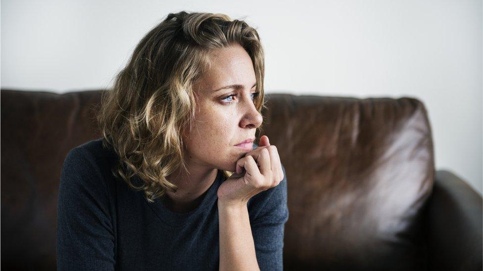 woman sitting on a sofa