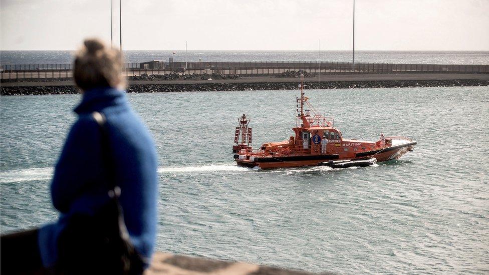 person looking at maritime rescue services boat