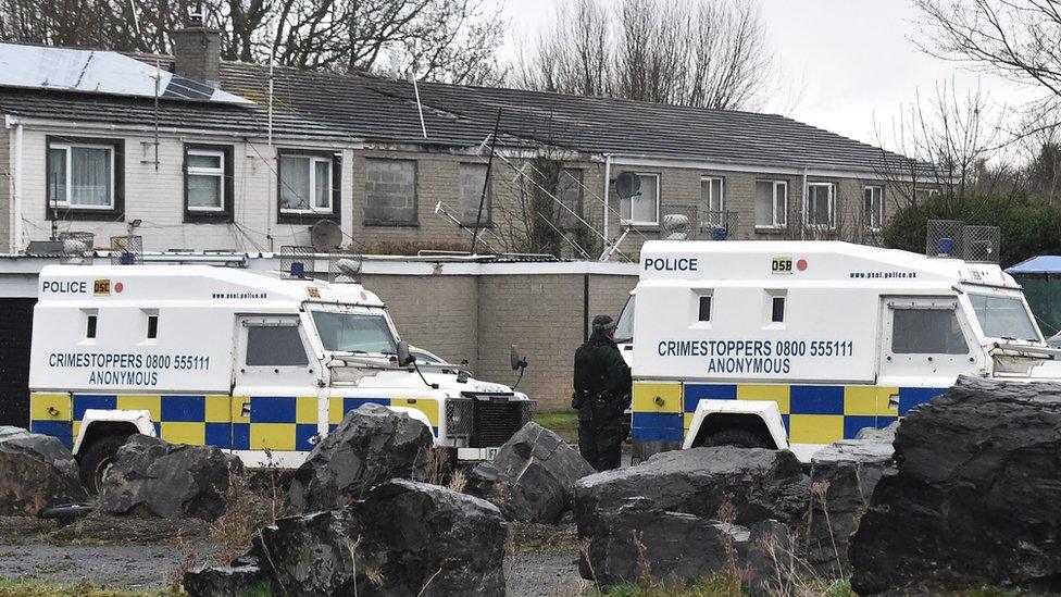 Police Land Rovers close to the scene of Nathan Gibson's murder