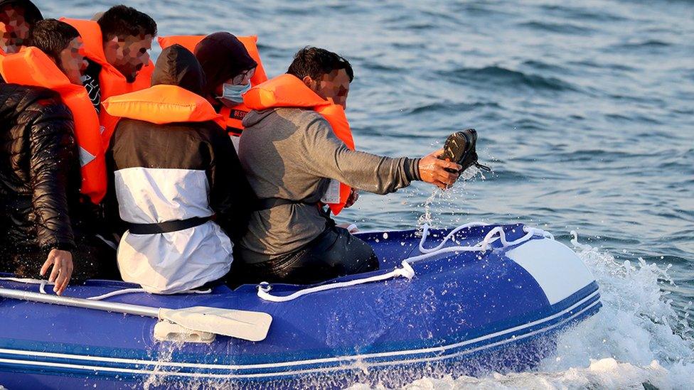 A group of people thought to be migrants crossing the Channel in a small boat headed in the direction of Dover, Kent.