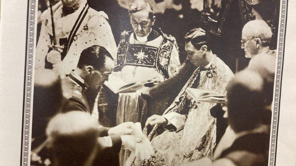 King George VI receiving glove at coronation