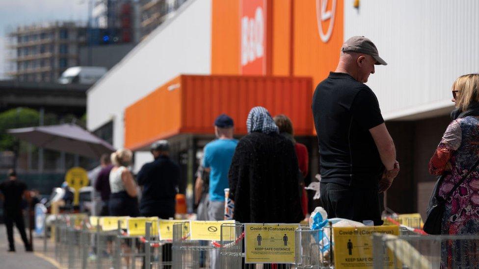 People queuing outside a B&Q store