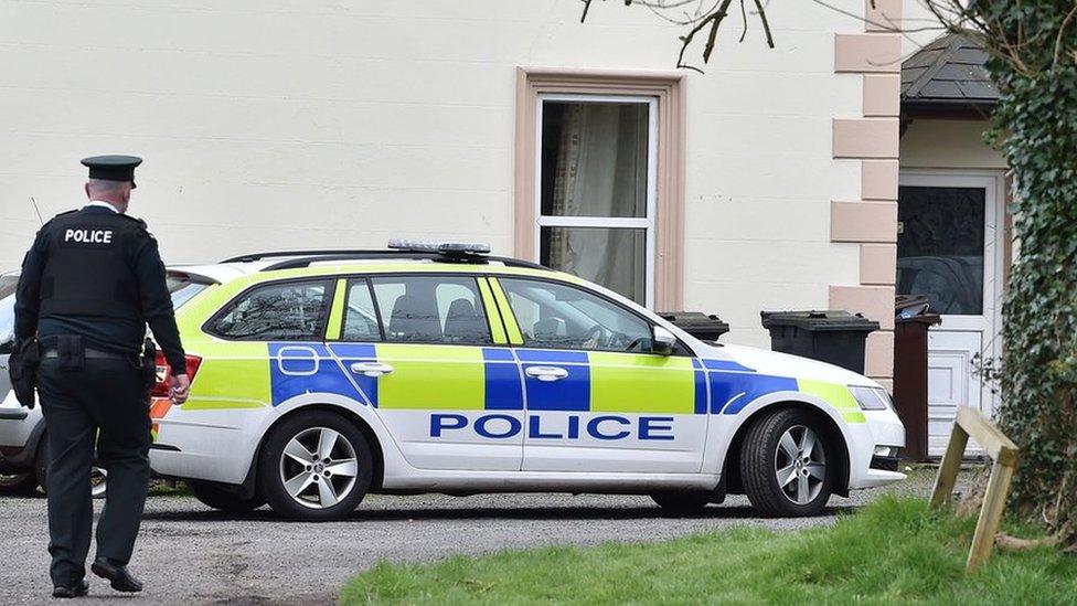 A police officer pictured from behind at the scene on Glenville Road on Saturday Morning