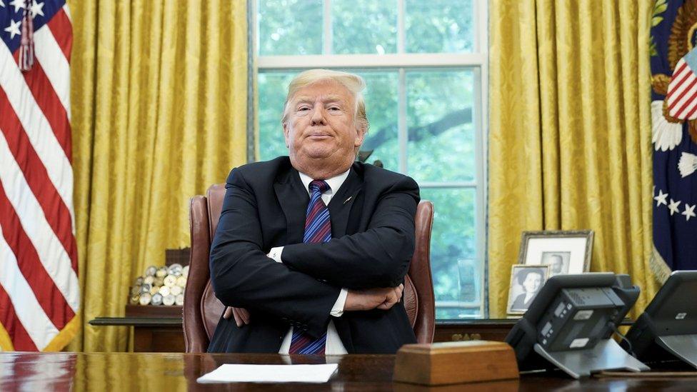 In this file photo taken on August 27, 2018 US President Donald Trump speaks to reporters after a phone conversation with Mexico"s President Enrique Pena Nieto on trade in the Oval Office of the White House in Washington, DC.