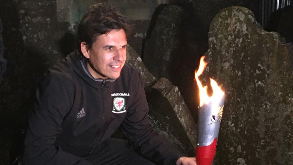 Chris Coleman at the grave of Welsh runner Guto Nyth Bran