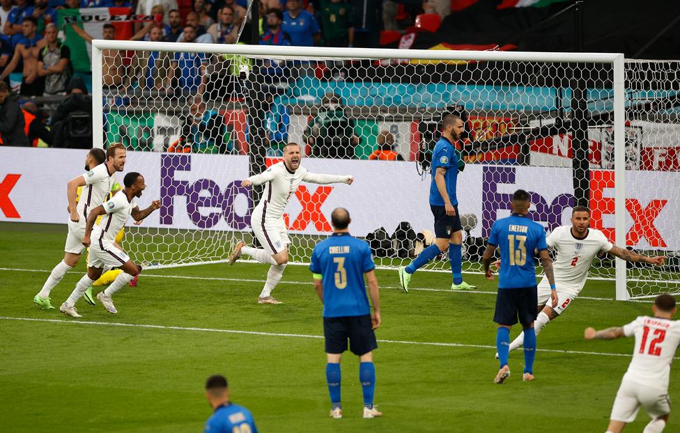 Luke Shaw of England celebrates after scoring their side's first goal during the UEFA Euro 2020 Championship Final between Italy and England at Wembley Stadium on July 11, 2021 in London, England.