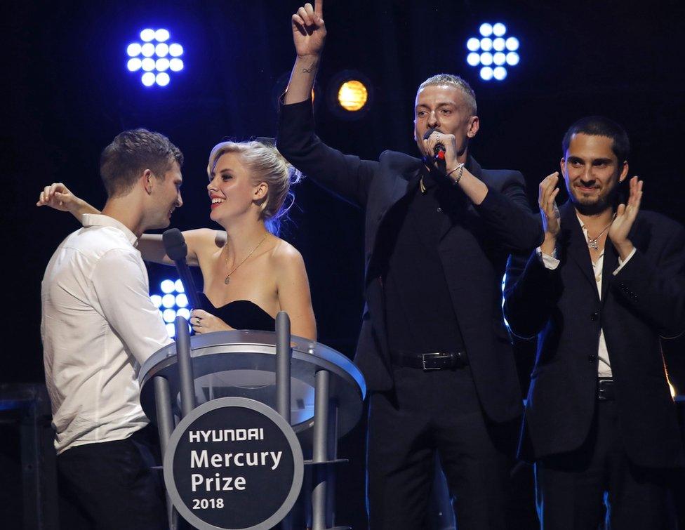 Joff Oddie, Ellie Rowsell, Theo Ellis and Joel Amey of Wolf Alice celebrate their award