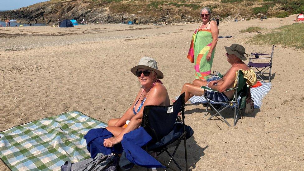 People on beach at Trecastell