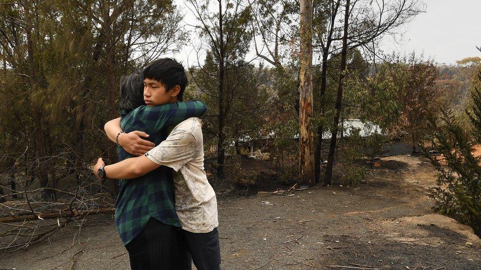 Gabriel Kam hugs his mother