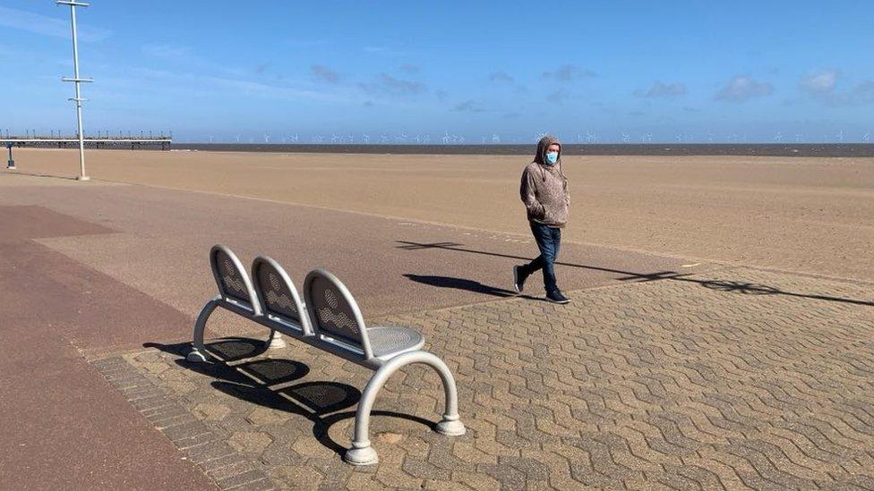 Man walking on Skegness beach during lockdown