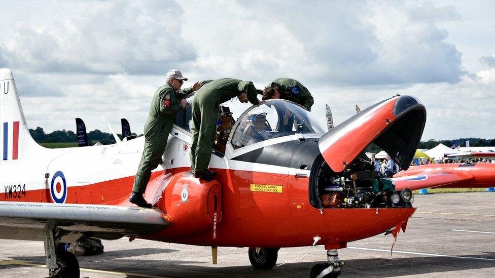 Crew examining an aircraft