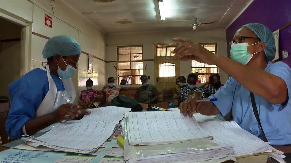 Two nurses working at a desk