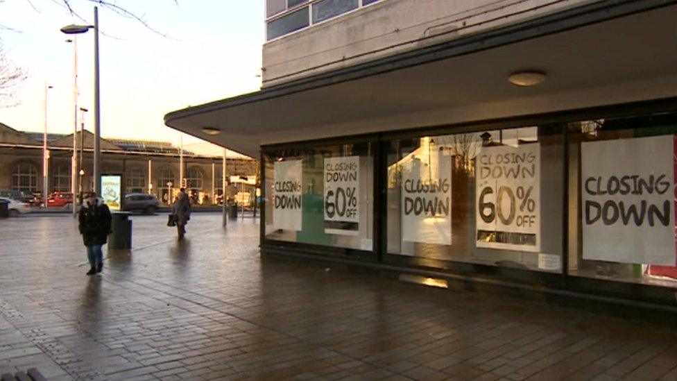 Closing down posters in the window of House of Fraser