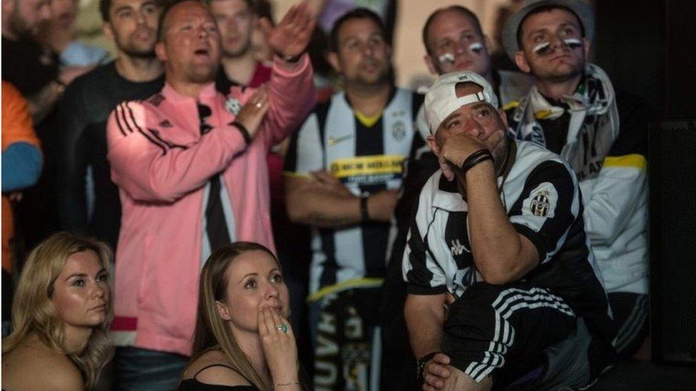 Fans watching the game on the big screen in The Depot near Cardiff Bay