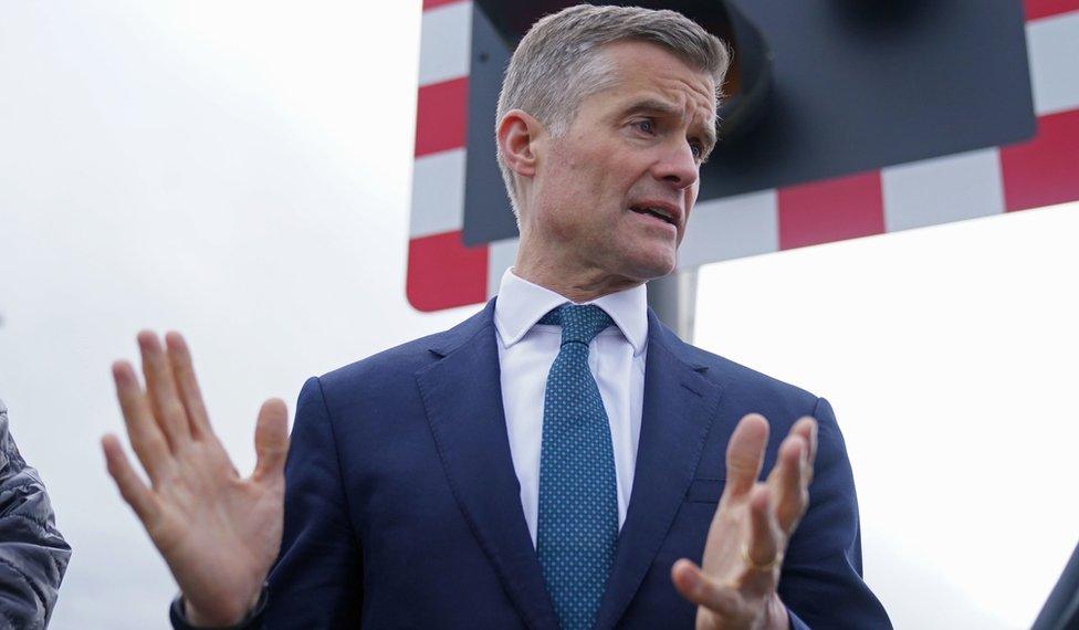 Transport Secretary Mark Harper at a level crossing near Blyth