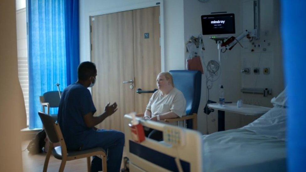 Surgeon Mr Ravi de Silva talking to Mrs Connor ahead of the operation