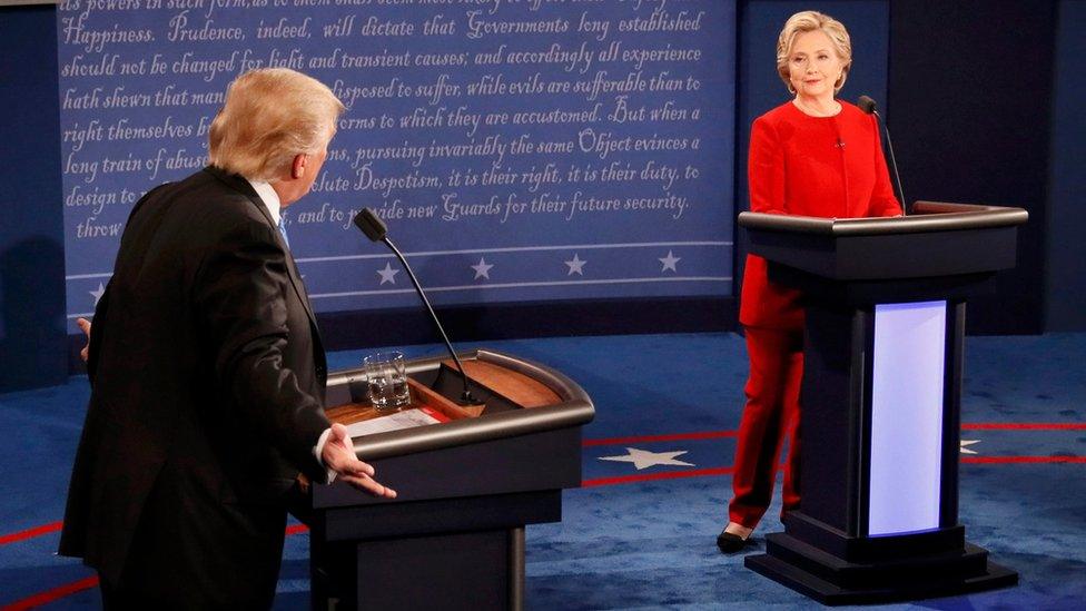 Republican US presidential nominee Donald Trump speaks as Democratic US presidential nominee Hillary Clinton listens during their first presidential debate at Hofstra University in Hempstead, New York