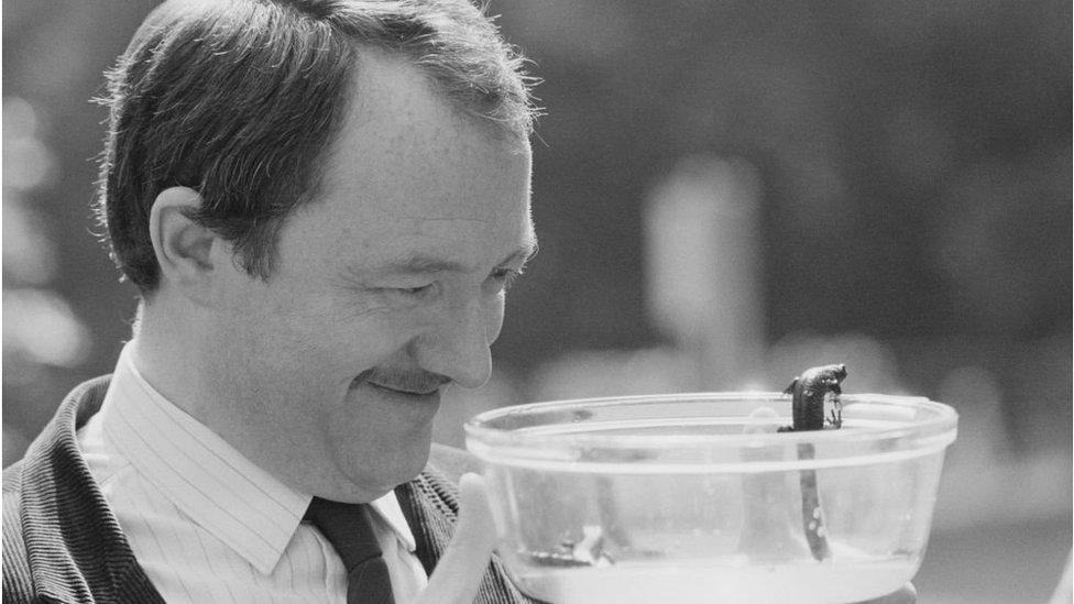 Ken Livingstone looking at a bowl of newts