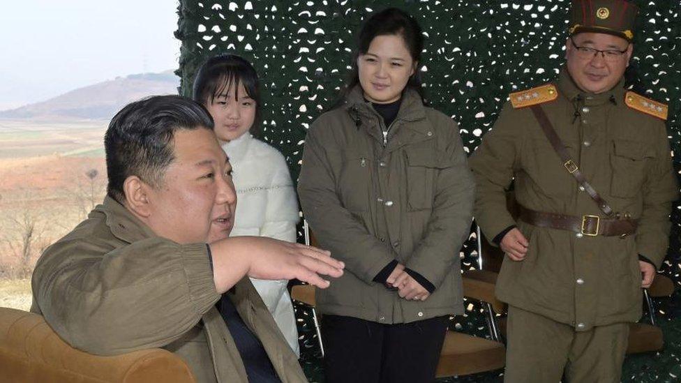 Mr Kim with his wife and their daughter