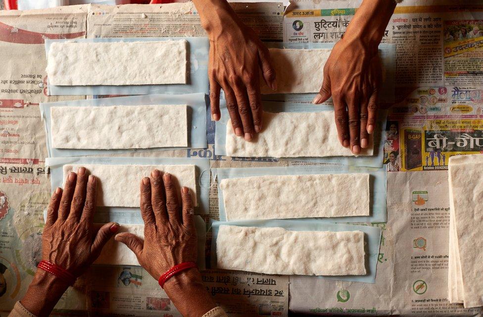 Women making sanitary pads