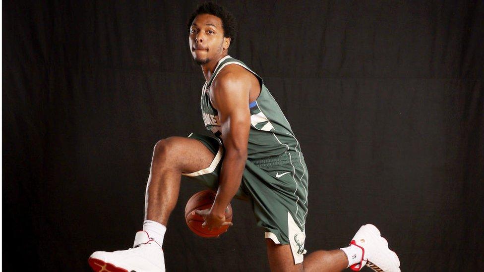 Sterling Brown poses for a promotional photo for his team, the Miwaukee Bucks