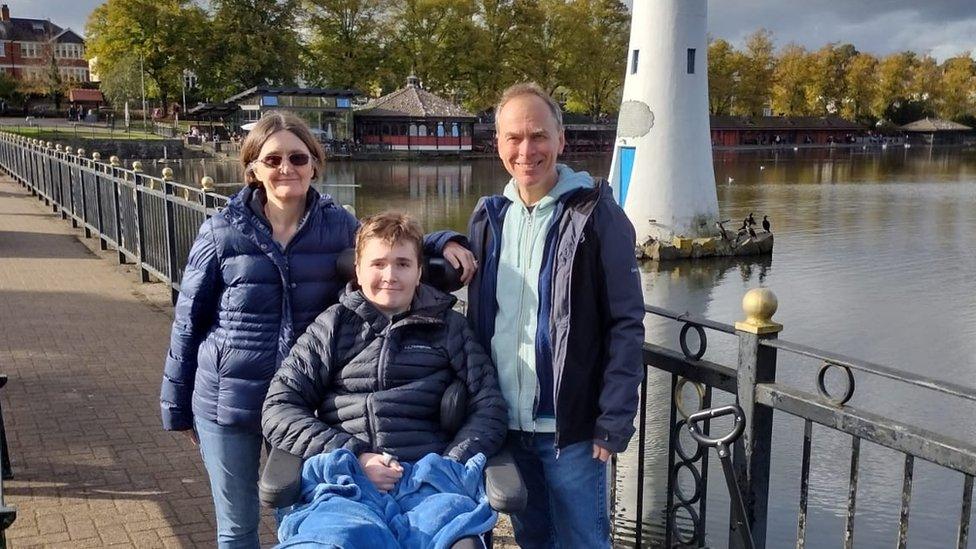 James, with his parents Alun and Janice