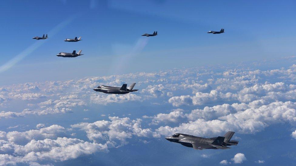 In this handout image provide by South Korean Defence Ministry, South Korea's F-15K fighter jets and US marine's F-35B fly over the Korean Peninsula during a training on 31 August 2017 in Gangwon-do, South Korea