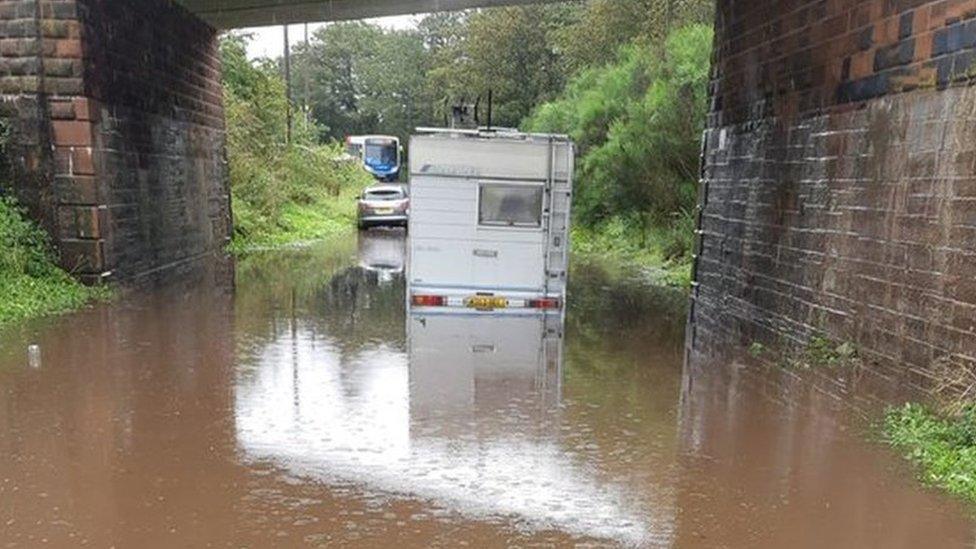 Cars and campervans flooded in tunnel