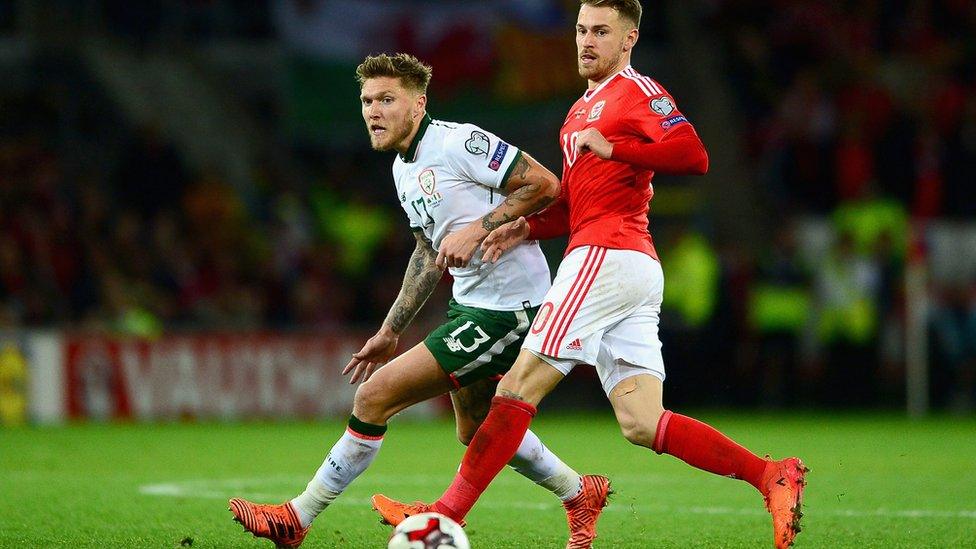 Jeff Hendrick of the Republic of Ireland and Aaron Ramsey of Wales battle for possession