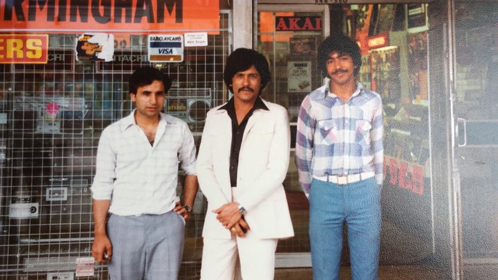 Mohammed Ayyub and others outside a record store