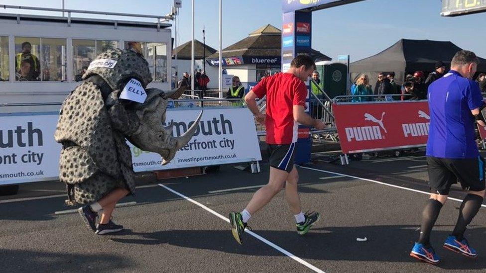 Runner in a rhino outfit