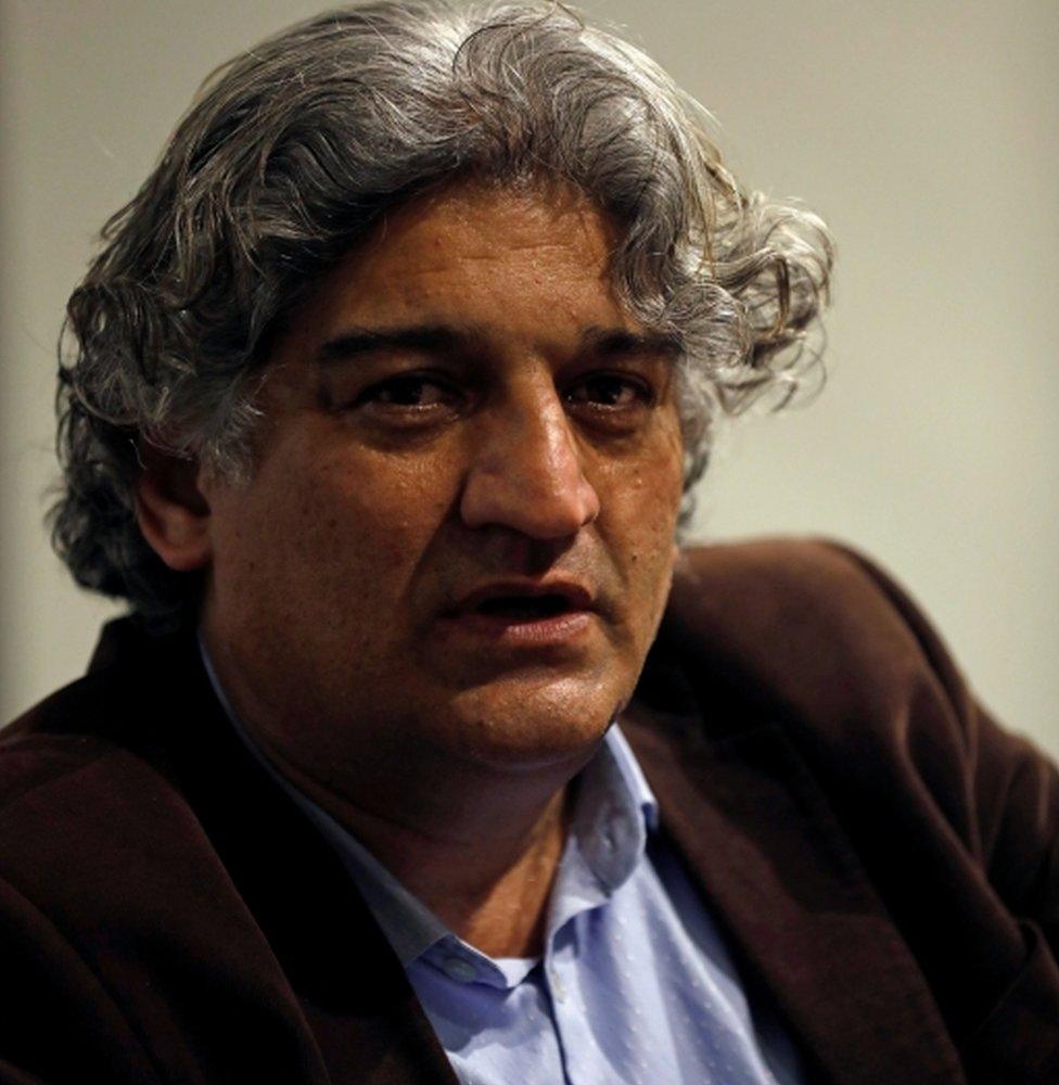 Matiullah Jan, a journalist and columnist, reacts during an interview with Reuters at his office in Islamabad, Pakistan March 13, 2019.