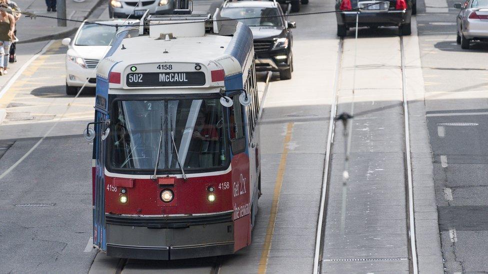 Old streetcar moving along Bay Street.