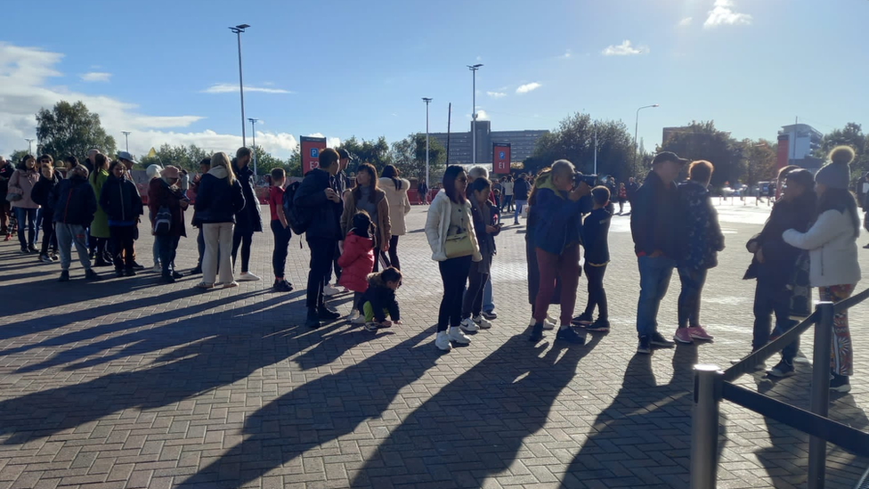 Fans joined a queue to sign the book of condolence