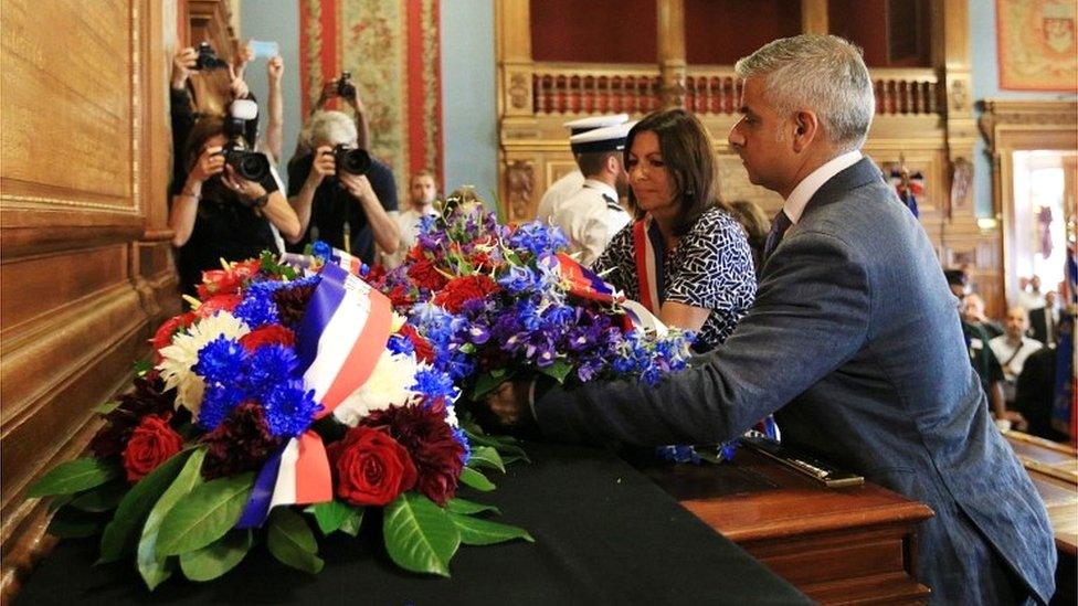 Mayor of London Sadiq Khan and Mayor of Paris Anne Hidalgo lay a wreath during a ceremony in Paris City Hall