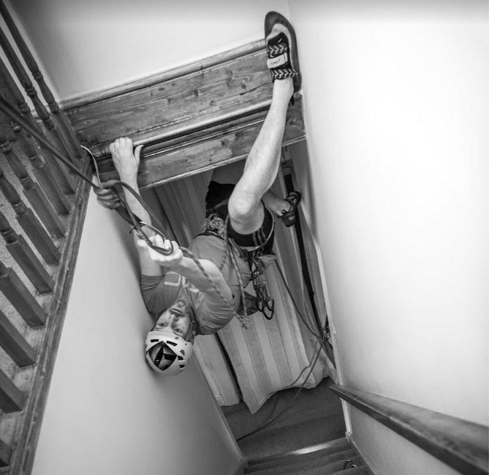 Man climbs in stairwell