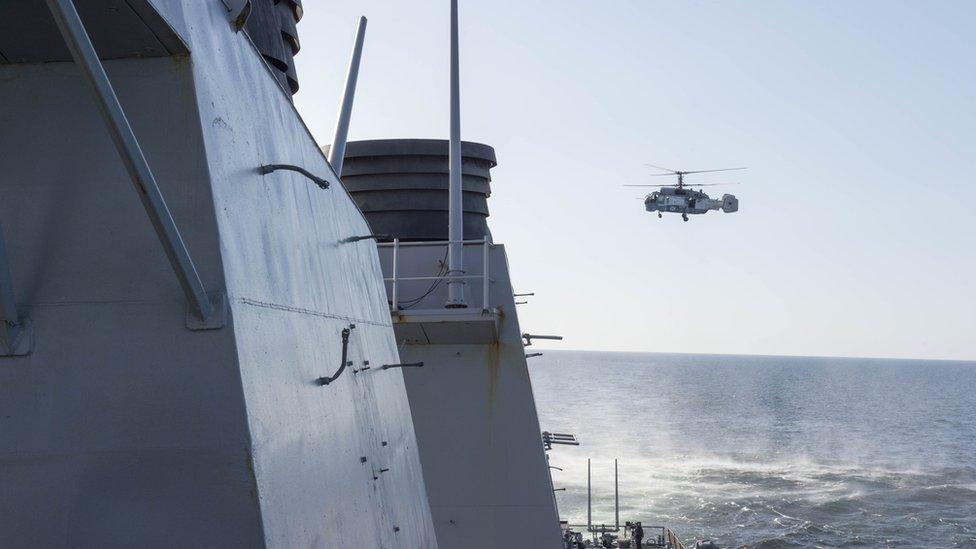 A Russian Kamov KA-27 Helix surveys USS Donald Cook on 12 April 2016