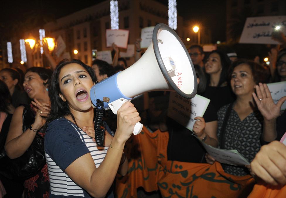 Moroccans shout slogans as they hold placards during a demonstration against the arrest of two Moroccan women after their outfits were deemed inappropriate, in Rabat, Morocco, 29 June 2015. Two Moroccan women, who walked through a market wearing dresses, are facing charges of 'gross indecency', sparking an outcry in Morocco. The women were arrested on 16 June as they strolled through the open-air market in Inezgane, near Agadir city