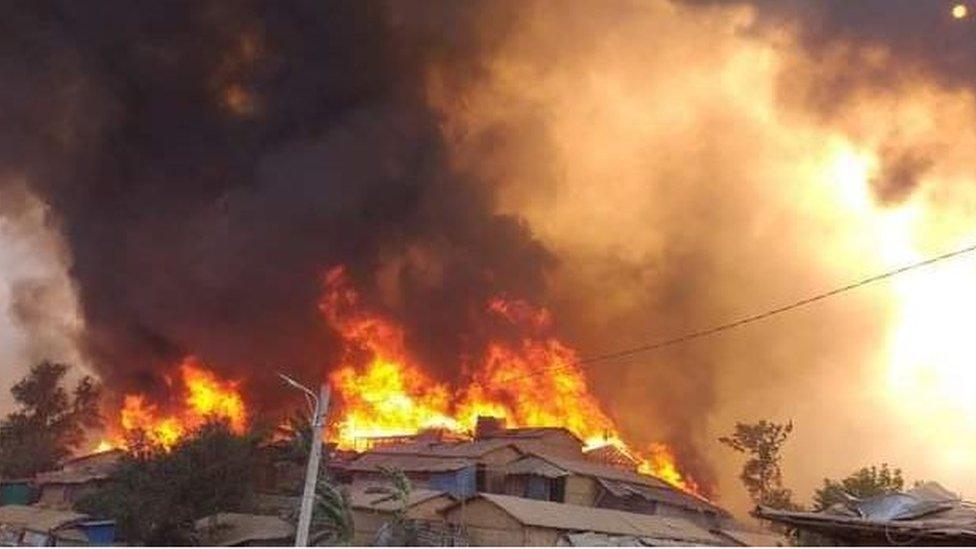 Intense flames engulfing the refugee camp