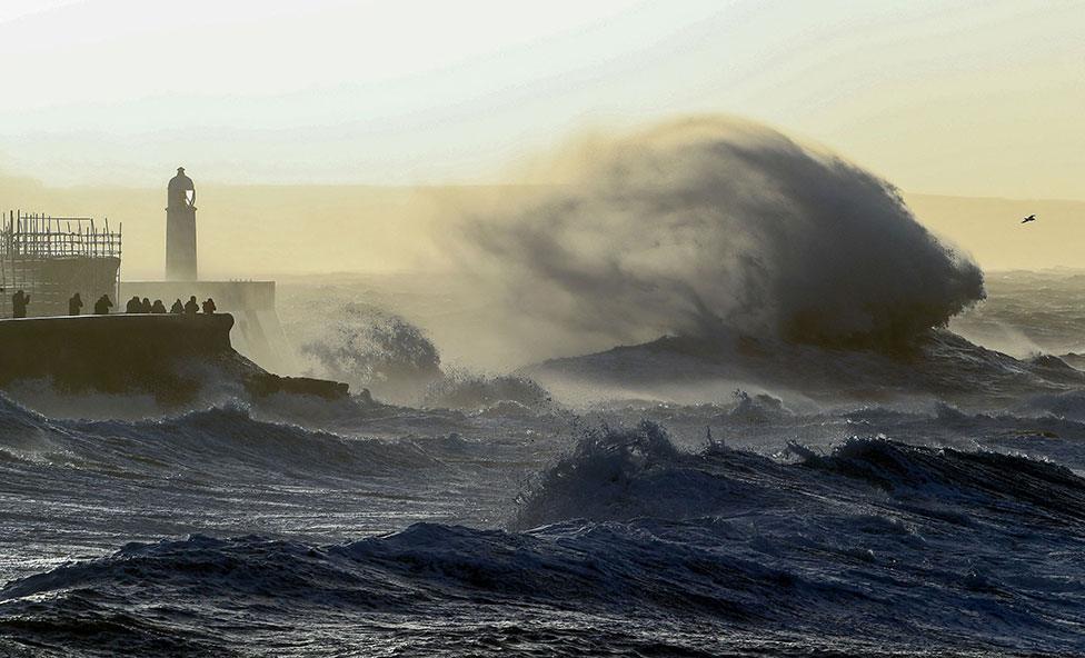 Waves crash against the sea wall at Porthcawl, south Wales, on 18 February 2022