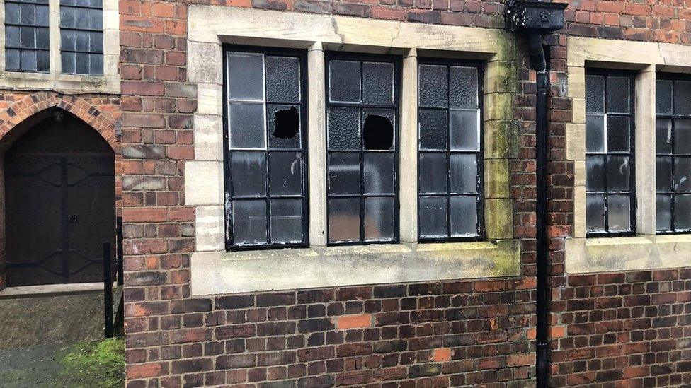 Church windows smashed